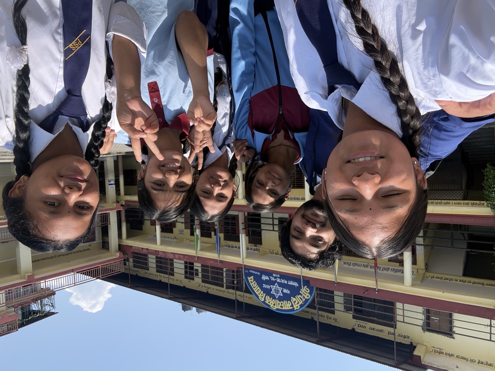 Students outside the Shree Pardi Secondary School building after the session