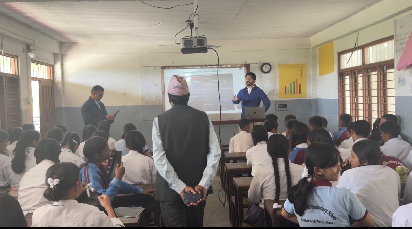 Teaching Wolfram Alpha for maths and science to students, with a projector showing the tool